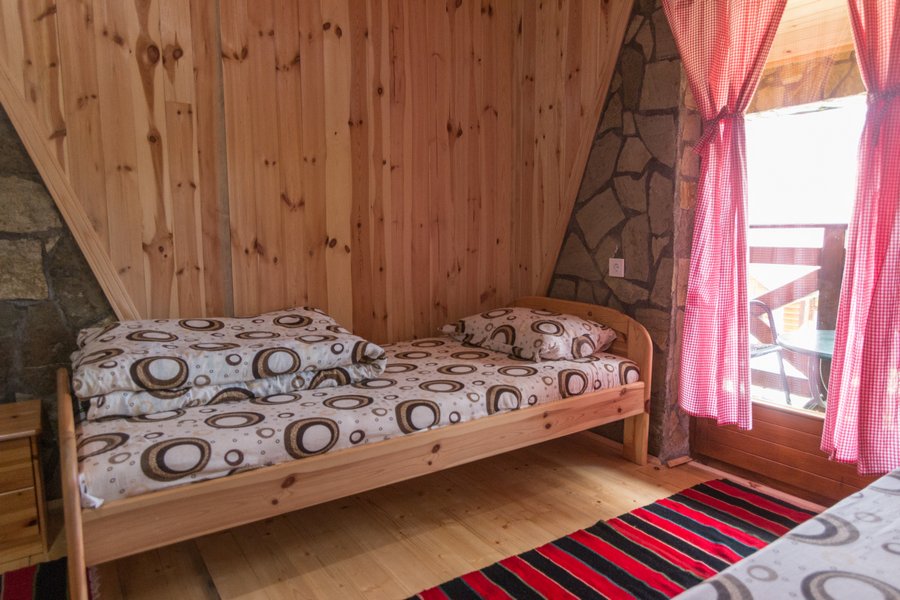 Single bed beside terrace door
