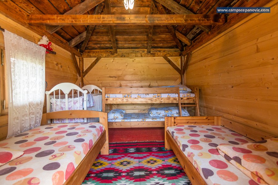 Family cabin interior with beds and bunk bed
