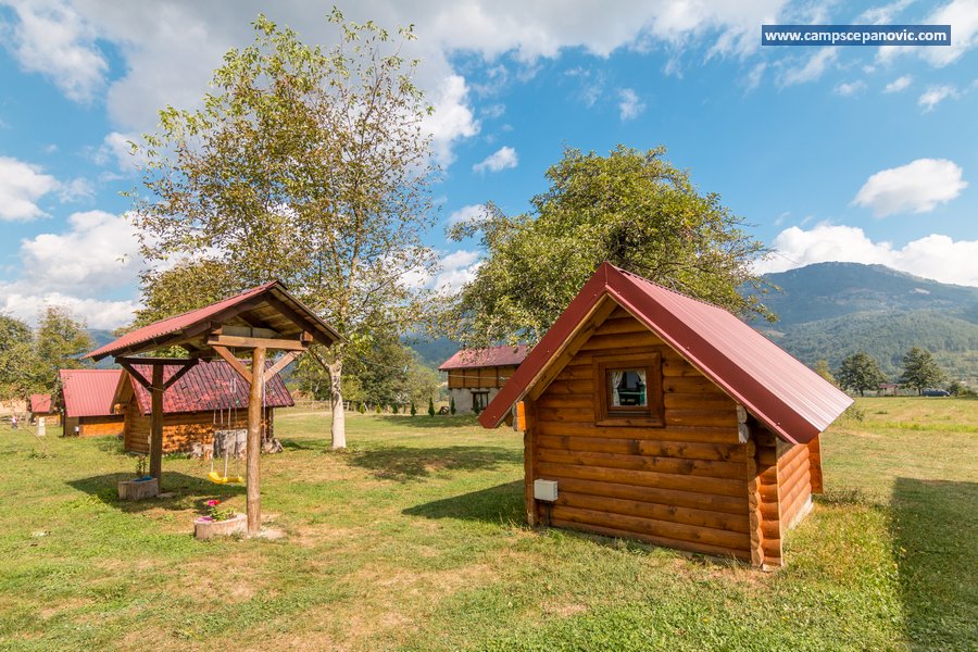 Cabin exterior near gazebo and mountain view