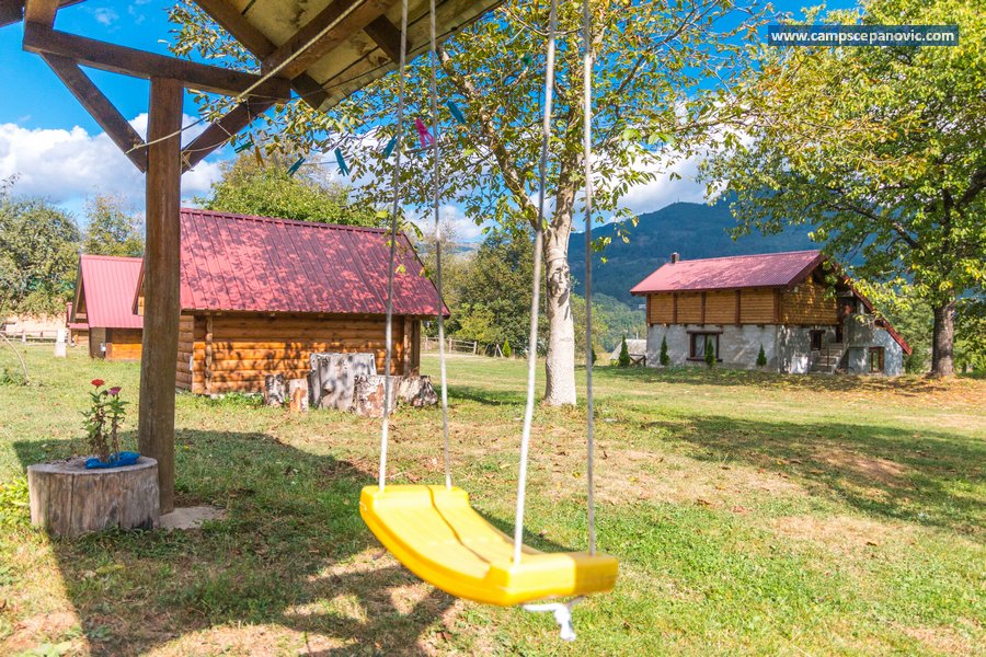 Camp yard with swing and cabins
