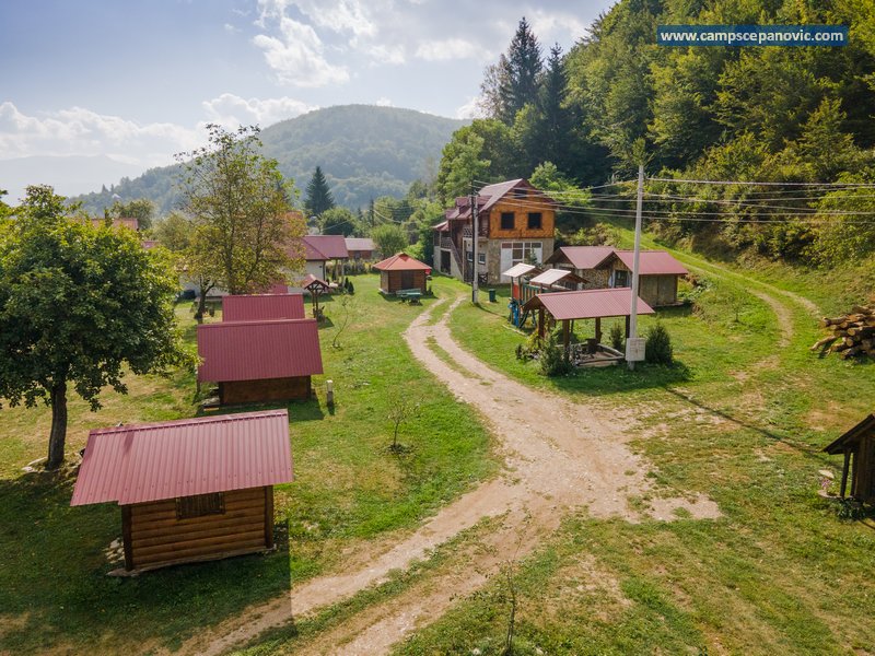 Camp path with cabins and main building