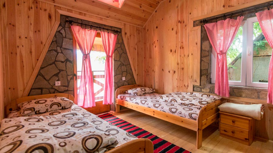 Wooden apartment room with twin beds